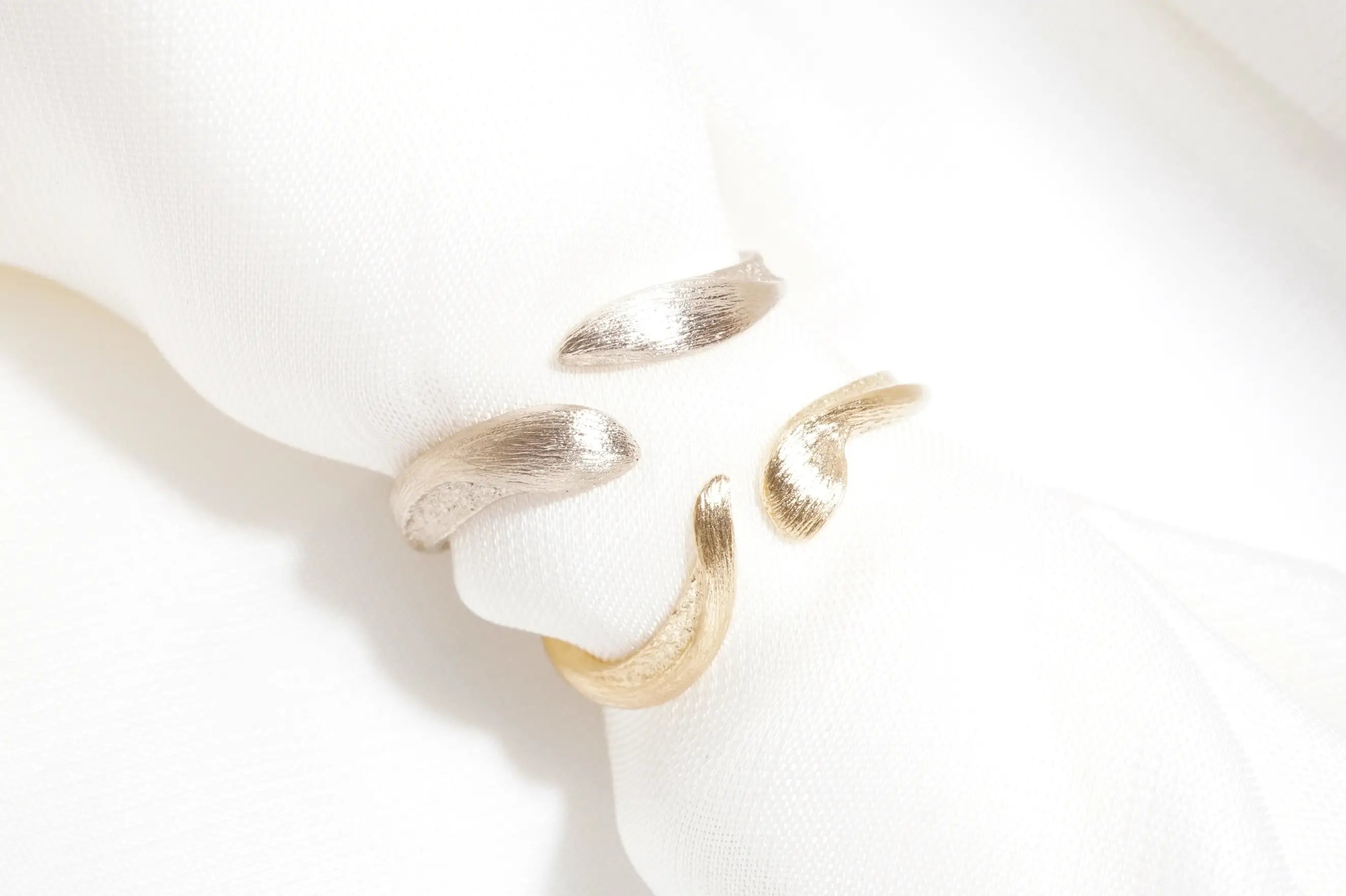 Chia Jewelry custom 14kt gold wedding ring unique design. Inspired by animals and pet.