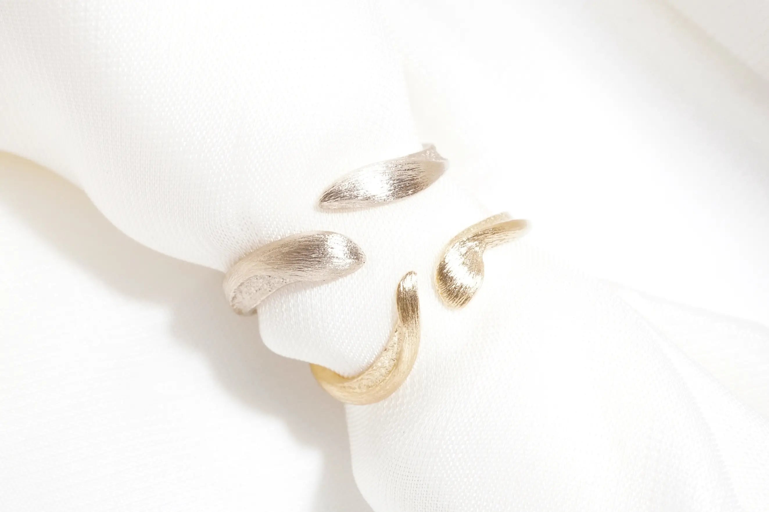 Chia Jewelry custom 14kt gold wedding ring unique design. Inspired by animals and pet.