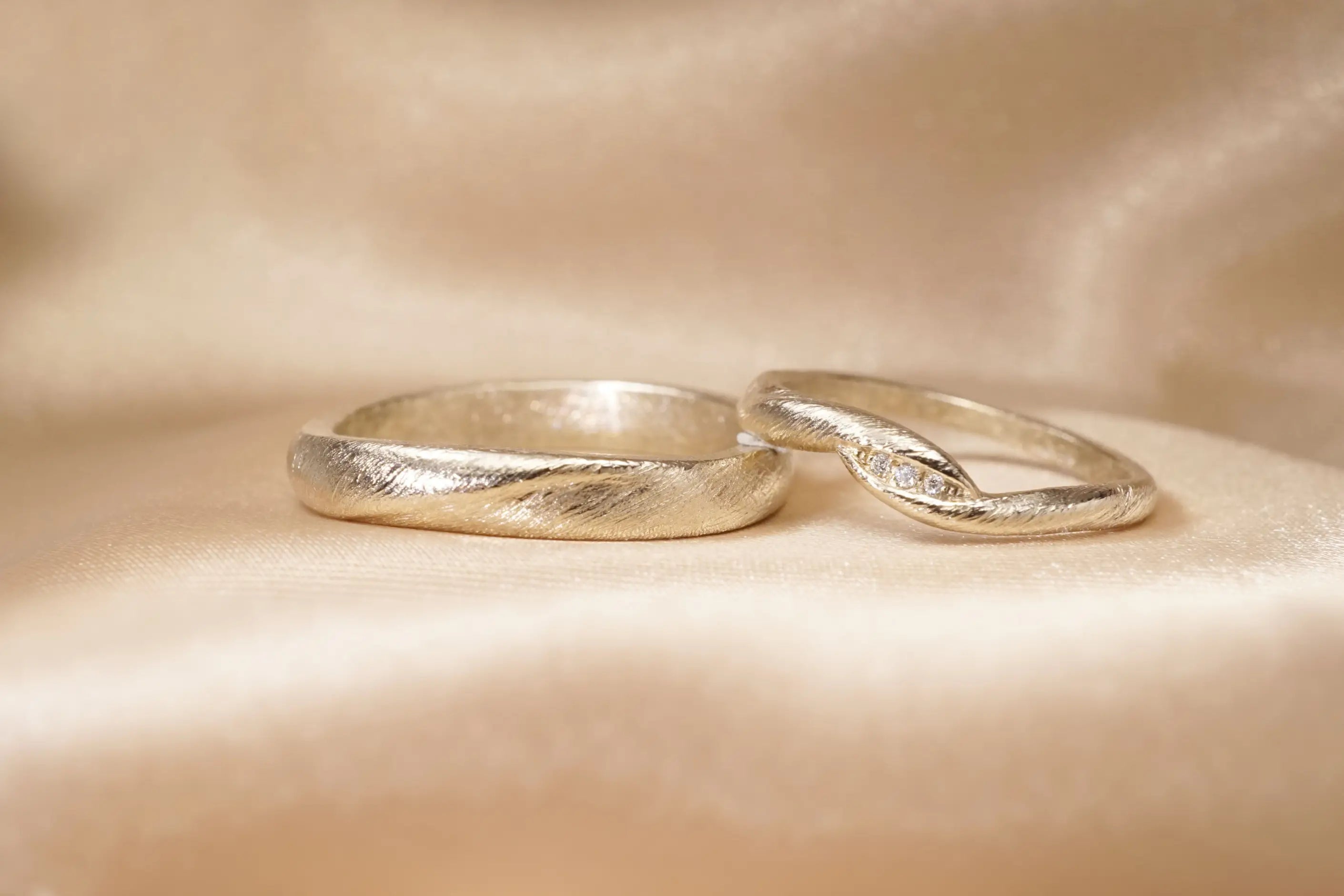 Chia_Jewelry_custom_wedding_rings_unique_design_with_14kt_gold_and_diamonds._Inspired_by_Harmonizing-13.webp